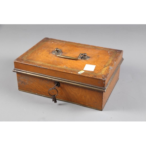 210 - A late 19th century grained as oak metal strong box, 14