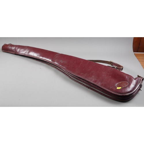 228 - A pair of maroon leather shotgun slips/cases, 50