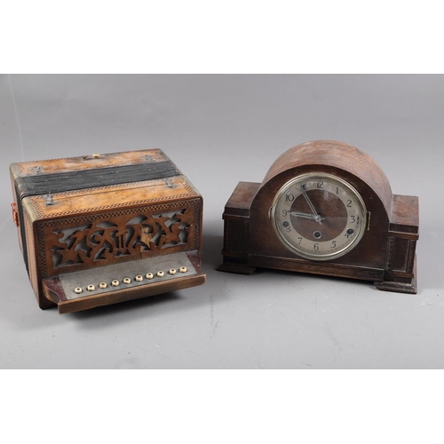 297 - A maple and marquetry banded accordion, and an oak cased mantel clock with silvered dial and Arabic ... 