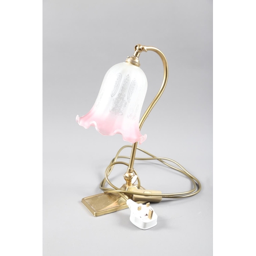 312 - An adjustable brass desk lamp with pink etched shade