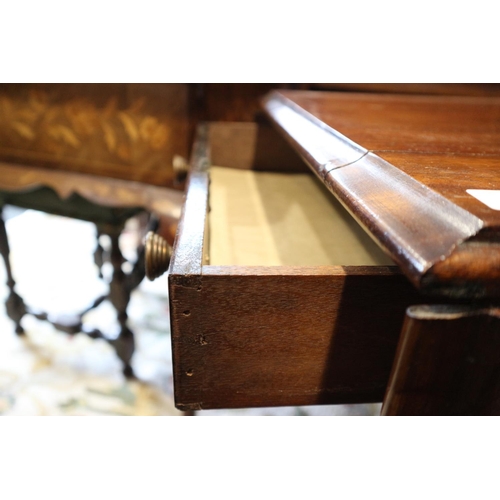 505 - A mahogany sofa table, fitted single drawer, on brass claw and castored splay supports, 42