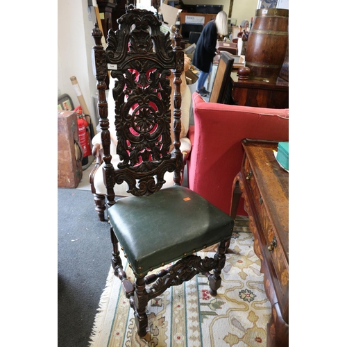 544 - A carved oak side chair of early 17th century design with pierced scrollbar back and stuffed over se... 