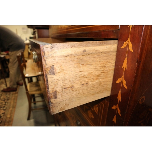 546 - An 19th century Dutch marquetry chest of six long graduated drawers, with swag and a lyre design, ri... 