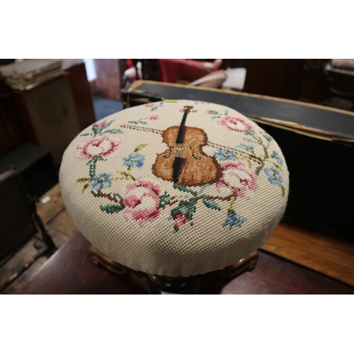 587 - An early 20th century carved walnut circular seat piano stool, on tripod splay support (adjustable m... 