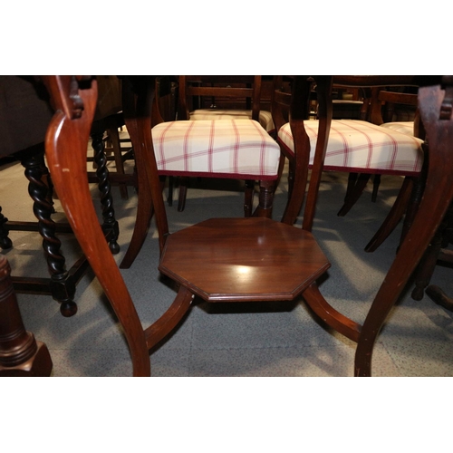 617 - A 1920s walnut octagonal two-tier occasional table, on cabriole supports, 30