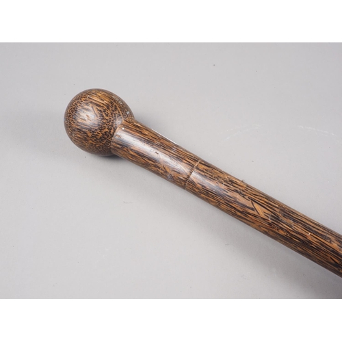 192 - A palm wood walking stick, 35