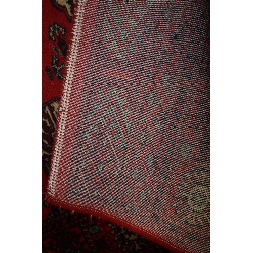 679 - A Bokhara style runner with thirty-six guls in traditional shades, 25