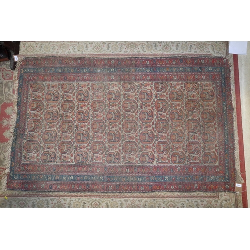 686 - A Herati rug with all-over boteh and animal design on a white ground and triple bordered in shades o... 