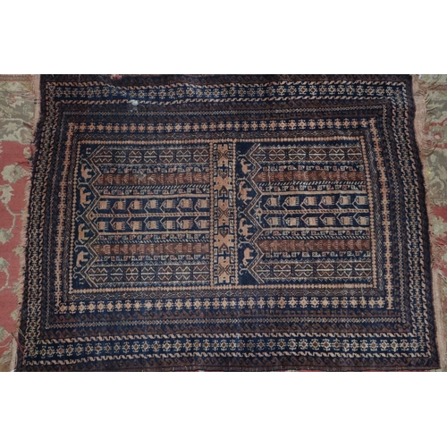 691 - A tribal prayer rug with animal, tree of life design in two panels and multi-scrolled bordered in sh... 