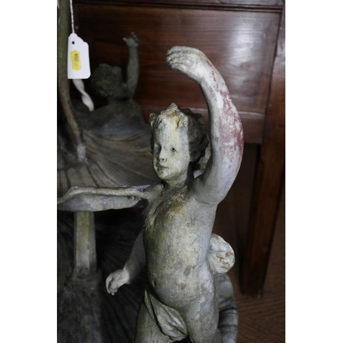 695 - A cast lead two-tier shell and putti fountain, on dolphin triform base, 36