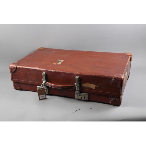 275 - An early 20th century leather suitcase, 28