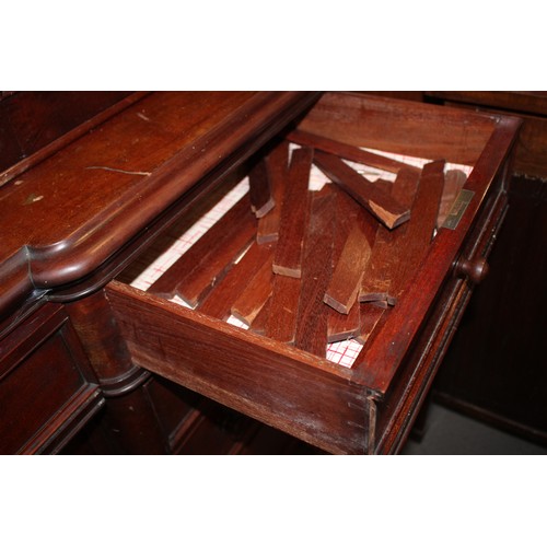 515 - A late Victorian mahogany inverse breakfront bookcase enclosed four glazed doors over cupboards  on ... 