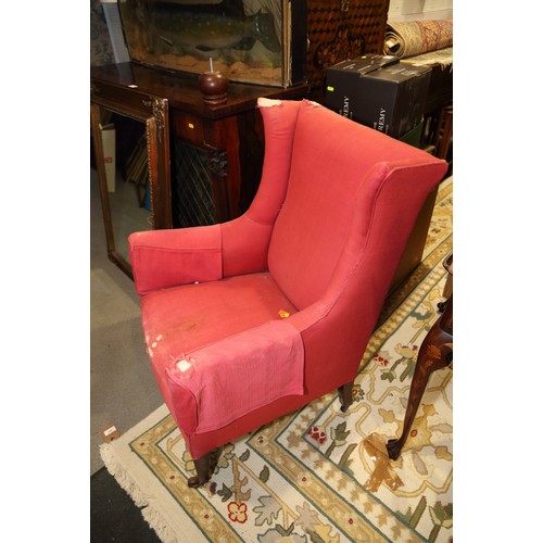 646 - An Edwardian armchair with loose cover, on square taper supports