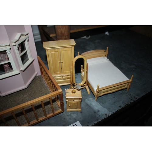 236 - A dolls' house and a quantity of dolls house of furniture