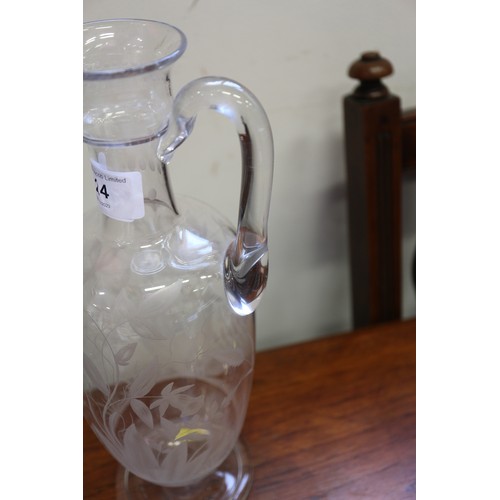 24 - A late 19th century engraved carafe, 11