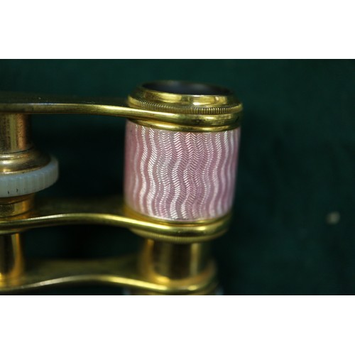 271 - A pair of gilt brass and pink guilloche enamel opera glasses by J Duvelleroy, London, a lorgnette an... 