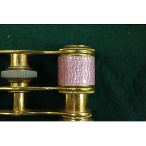 271 - A pair of gilt brass and pink guilloche enamel opera glasses by J Duvelleroy, London, a lorgnette an... 