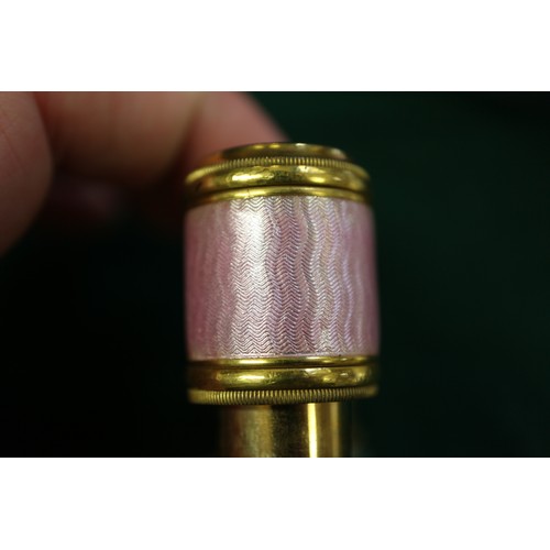 271 - A pair of gilt brass and pink guilloche enamel opera glasses by J Duvelleroy, London, a lorgnette an... 