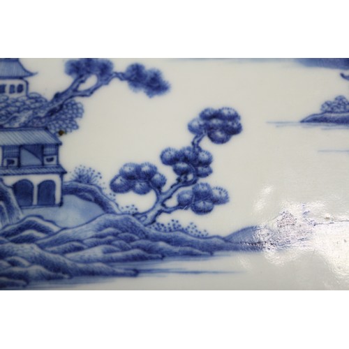 137 - A pair of Chinese oval shaped platters with landscape decoration, 13 1/4