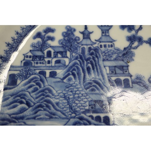 137 - A pair of Chinese oval shaped platters with landscape decoration, 13 1/4