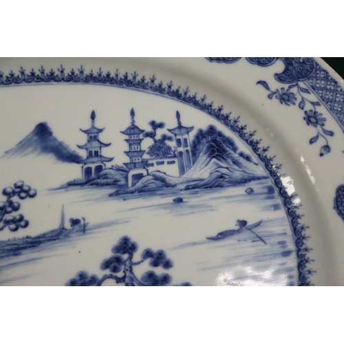 137 - A pair of Chinese oval shaped platters with landscape decoration, 13 1/4