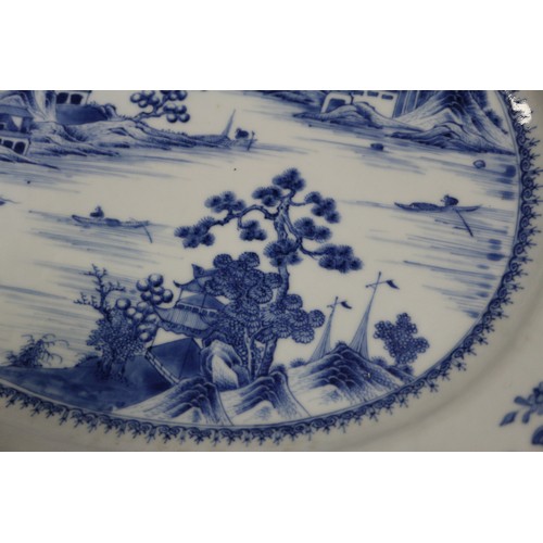 137 - A pair of Chinese oval shaped platters with landscape decoration, 13 1/4