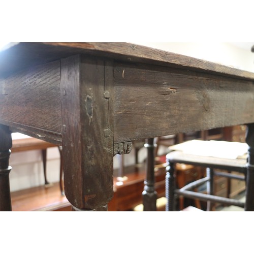 493 - An 18th century provincial carved oak side table, fitted one drawer, on turned and stretchered suppo... 