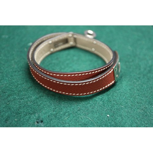 365 - A Hermes brown leather and white metal mounted bracelet