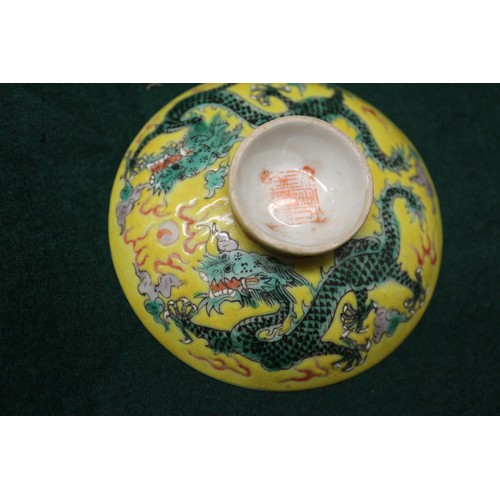 113 - A Chinese yellow glazed rice bowl, cover and stand with dragon decoration, seal mark to base, anothe... 