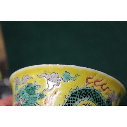 113 - A Chinese yellow glazed rice bowl, cover and stand with dragon decoration, seal mark to base, anothe... 