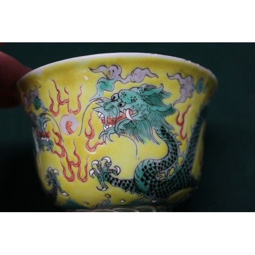 113 - A Chinese yellow glazed rice bowl, cover and stand with dragon decoration, seal mark to base, anothe... 