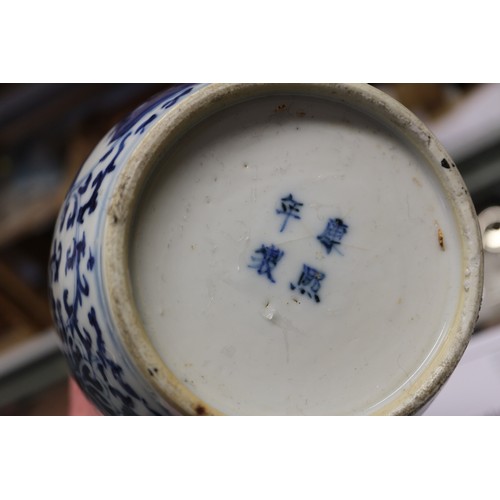 112 - A pair of Chinese blue and white double gourd vases with panelled figure decoration on a flower and ... 