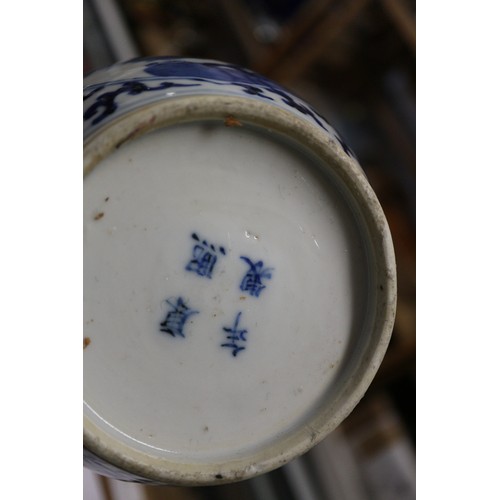 112 - A pair of Chinese blue and white double gourd vases with panelled figure decoration on a flower and ... 