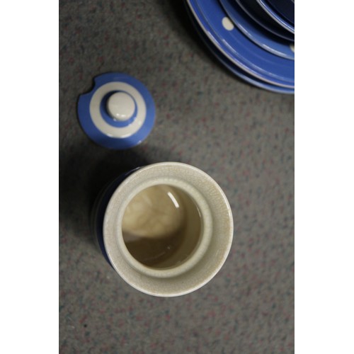 39 - A T G Green Cornishware blue and white banded sugar dredger, a similar polka dot decorated butter di... 