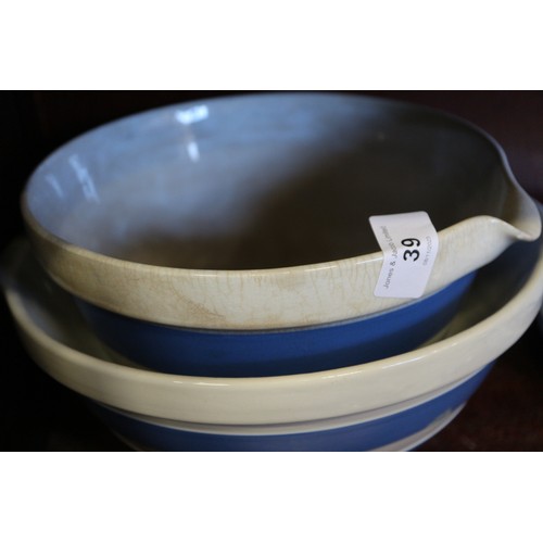 39 - A T G Green Cornishware blue and white banded sugar dredger, a similar polka dot decorated butter di... 