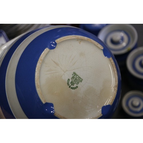 39 - A T G Green Cornishware blue and white banded sugar dredger, a similar polka dot decorated butter di... 