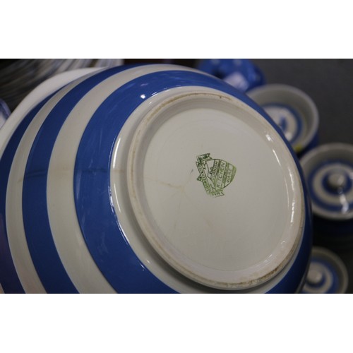 39 - A T G Green Cornishware blue and white banded sugar dredger, a similar polka dot decorated butter di... 