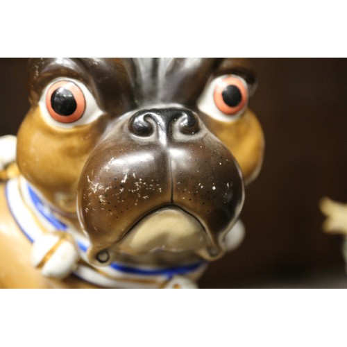 9 - An early 20th century Continental porcelain model of a pug, 9 1/2