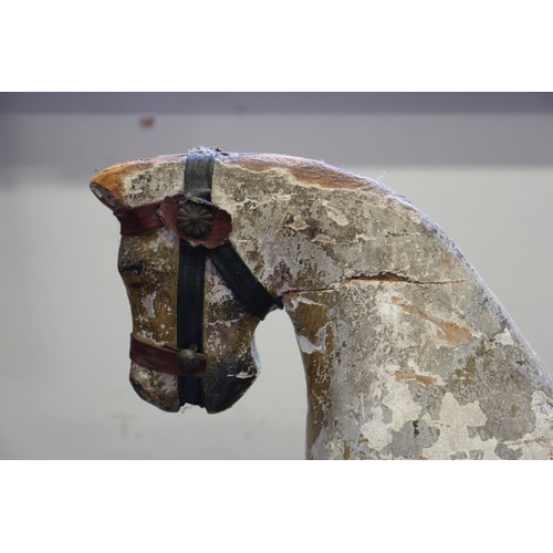 276 - An early 19th century carved wood and painted model horse, on base board, 15