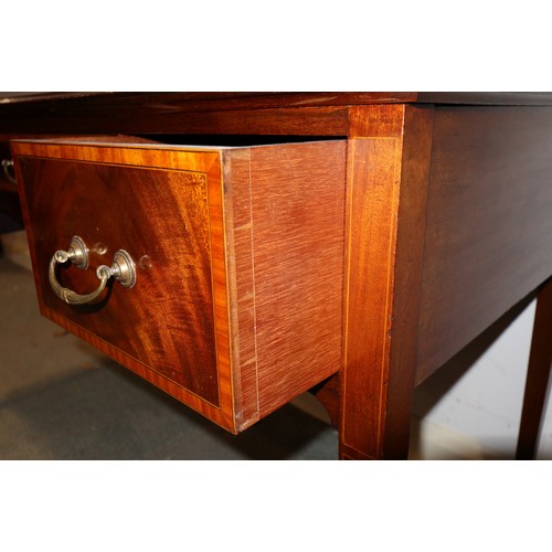 651 - An Edwardian mahogany and banded dressing table, fitted three drawers, on square taper supports, 47