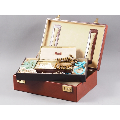 310 - A brown leather jewellery box, containing a selection of silver, costume and other jewellery