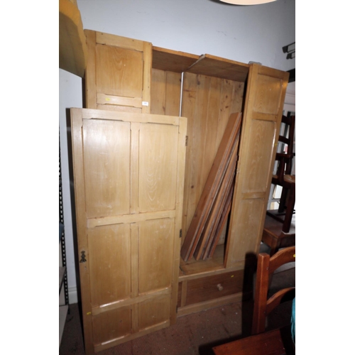 569 - A 19th century panelled pine linen cupboard enclosed single door over two drawers with ceramic knob ... 