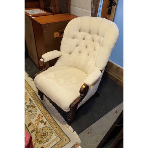 432 - A low armchair with circular seat, button and corded shell-shaped back, upholstered in a salmon broc... 