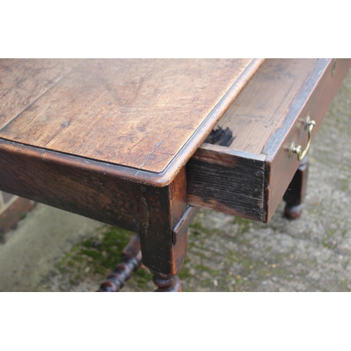 416 - A 19th century provincial oak side table, fitted one long drawer, on twist turned and stretchered su... 