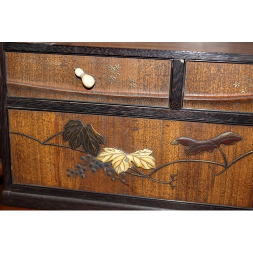 435 - A late 19th century Japanese lacquer and inlaid cabinet, fitted sliding doors over recess, three sma... 