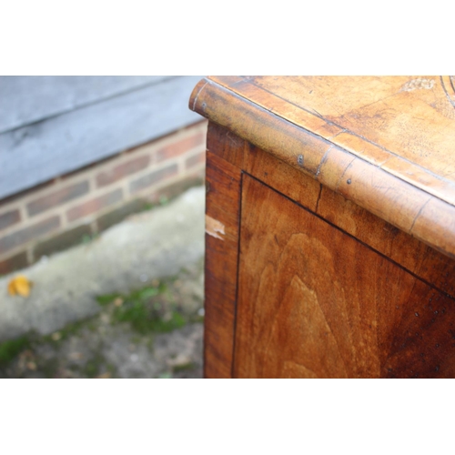 443 - An early 18th century figured walnut and banded chest on stand, the upper section fitted two small d... 