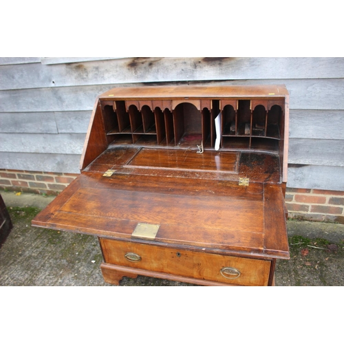 444 - An early 18th century walnut and fruitwood line inlaid fall front bureau, the interior fitted pigeon... 