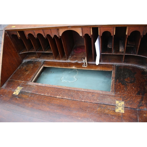 444 - An early 18th century walnut and fruitwood line inlaid fall front bureau, the interior fitted pigeon... 