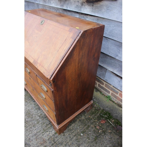 444 - An early 18th century walnut and fruitwood line inlaid fall front bureau, the interior fitted pigeon... 