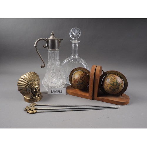 46 - A pair of glass decanters and stoppers, two others, a pair of bookends, formed as globes, meat skewe... 